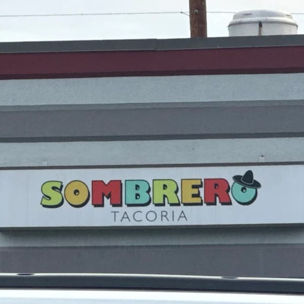 The colorful "Sombrero Tacoria" sign on the side of a building.